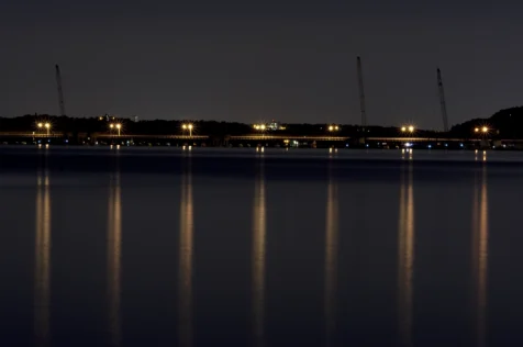 A row of lights on the Tappan Zee Bridge create reflections in the Hudson River near Nyack, New York, 2015.