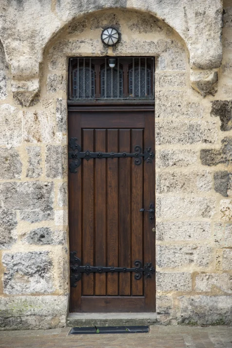 A narrow wooden church door in Geislingen an der Steige, Germany, 2023.
