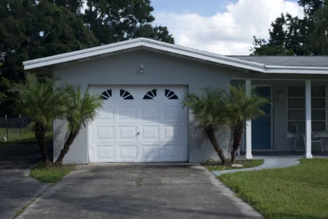 Little palm trees near a garage in Port Saint Lucie, Florida, 2016.