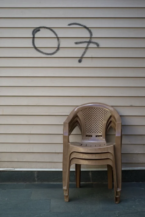 A stack of plastic chairs and graffiti in Antalya, Turkey, 2024.