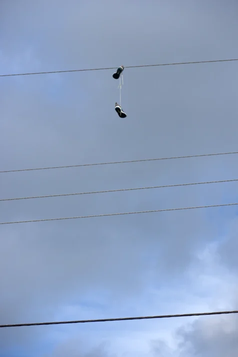 A pair of shoes hang from a power in Port Saint Lucie, Florida, 2016.