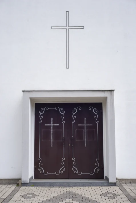 A simple white church exterior in Neu-Ulm, Germany, 2023.