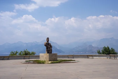 A statue and benches at an overlook near the Mediterranean Sea in Antalya, Turkey, 2023.