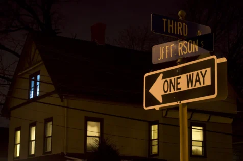 House and street signs at night in Nyack, New York, 2013.