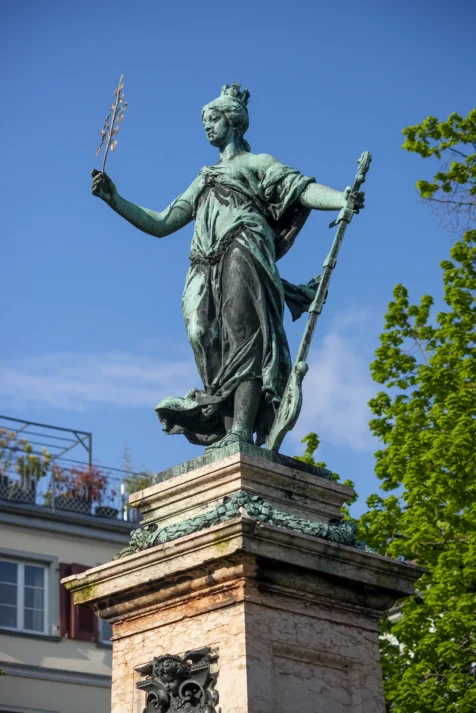 A sunlit statue on a gorgeous day in Lindau, Germany, 2023.