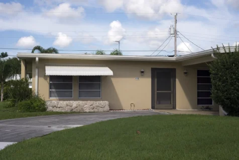 A tan house on a nice day in Port Saint Lucie, Florida, 2016.