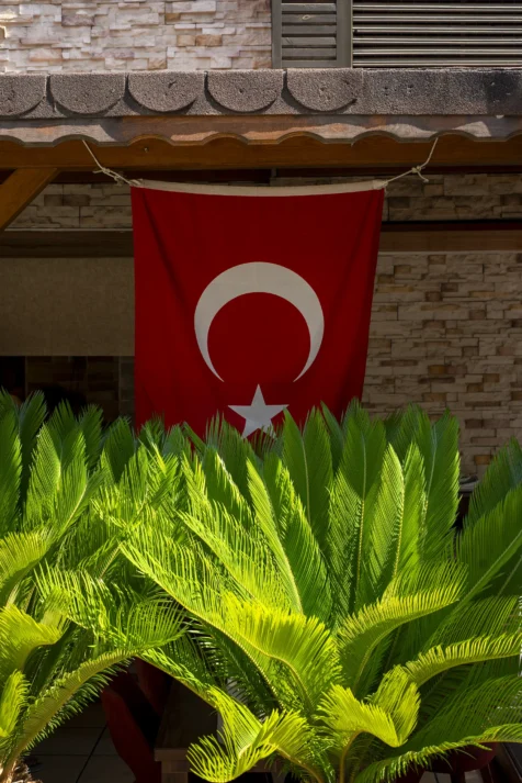 A Turkish flag hangs on a restaurant in Antalya, Turkey, 2023.