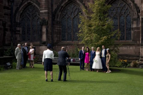 A photographer takes wedding portraits on a sunny afternoon outside Chester Cathedral in Chester, England, 2017.