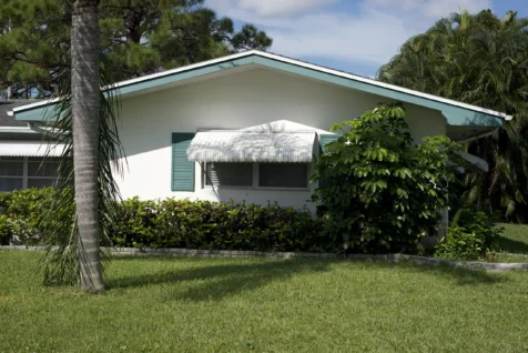 A white and teal house in Port Saint Lucie, Florida, 2016.