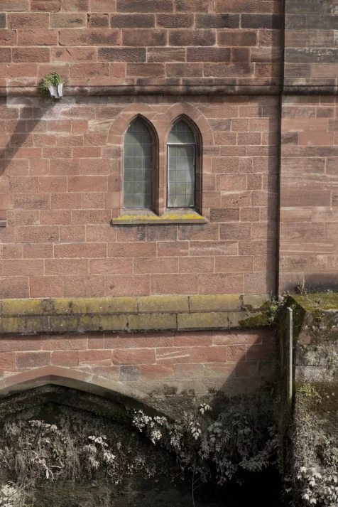 A pair of windows on an exterior bridge wall in Chester, Engalnd, 2017.