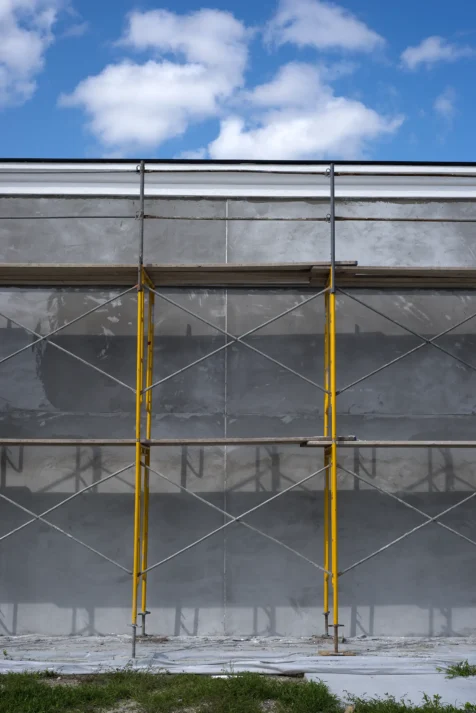 Yellow scaffolding next to a building on a lovely day in Florida, 2016.