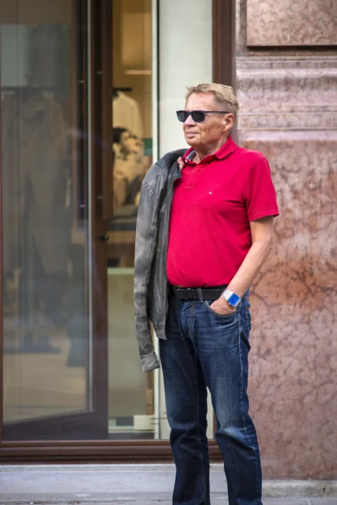 A man waits for his wife outside a luxury shop in Vienna, Austria, 2023.