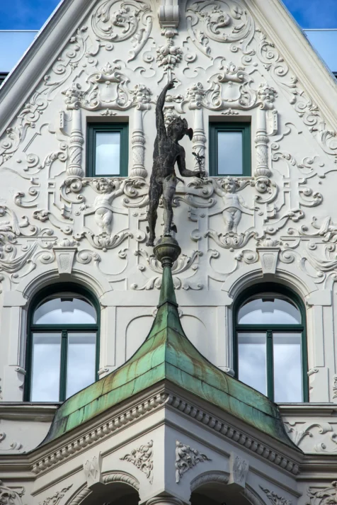 A metal statue on a building in Vienna, Austria, 2023.