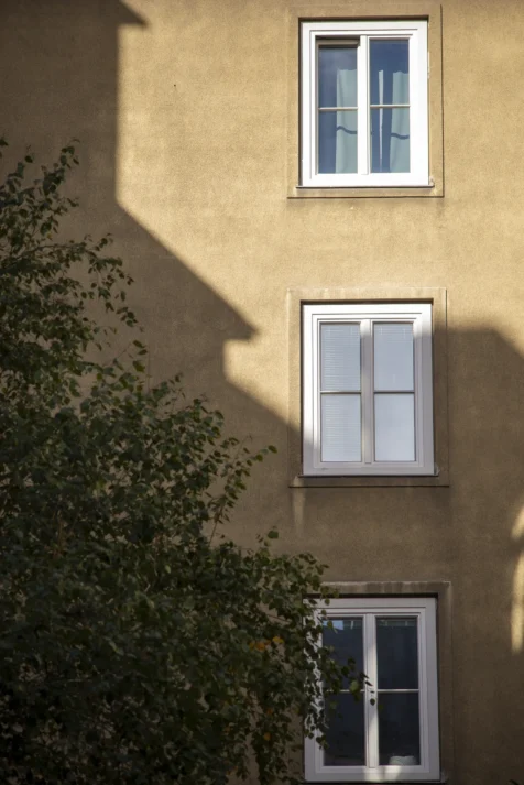 Windows and shadows on a building in Vienna, Austria, 2023,