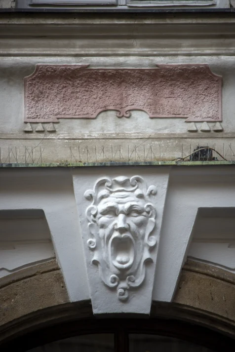 A face adorns an arch in Prague, Czech Republic.