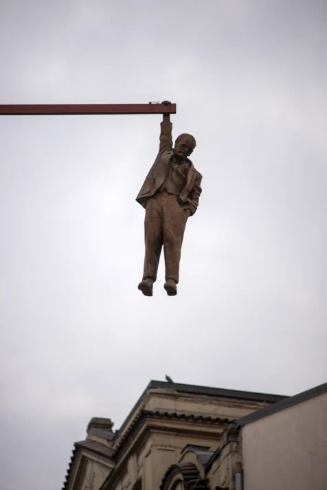A hanging statue above Old Town in Prague, Czech Republic.